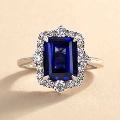 Halo Emerald Cut Blue Sapphire Ring